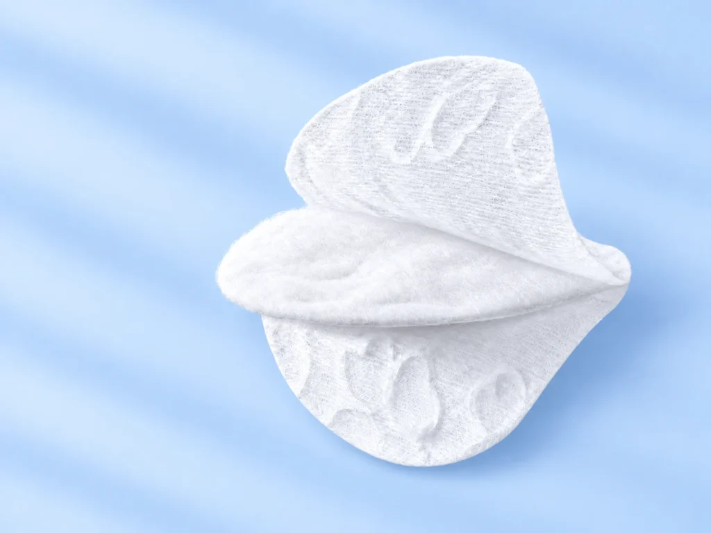 Three-layer cotton pad structure showing the outer layer, absorbent middle layer and embossed surface layer