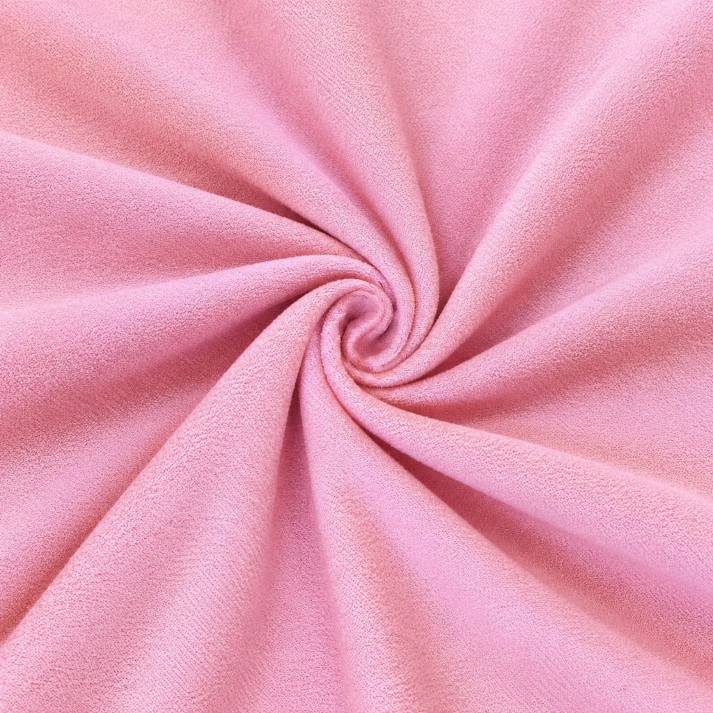 Close-up of pink microfiber ant fabric texture for custom yoga towels